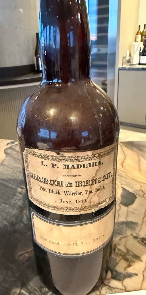 Antique Madeira bottle with 1840 import label and 1918 recork note